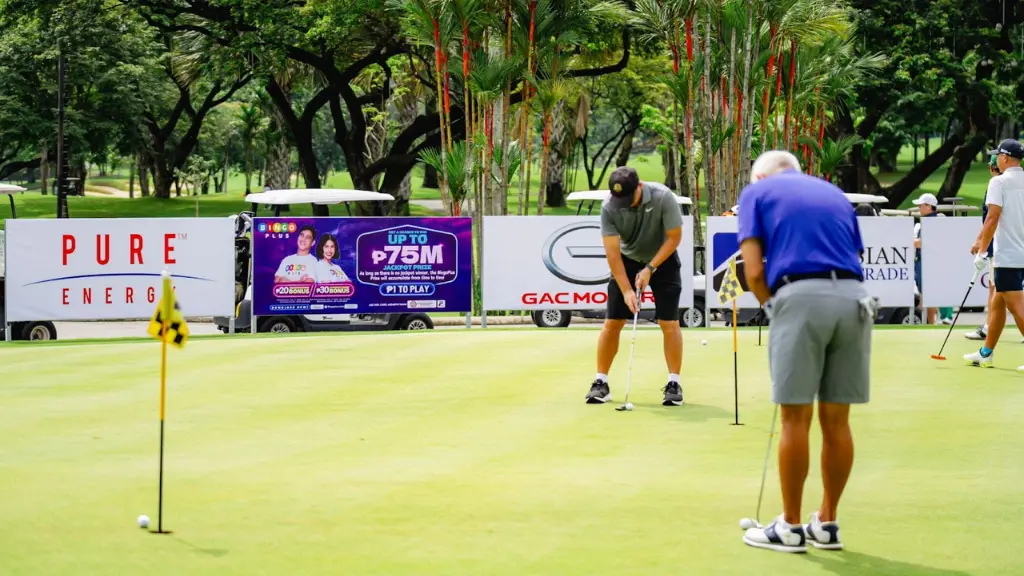 Golfers hitting the ball on the sponsorship ceremony course