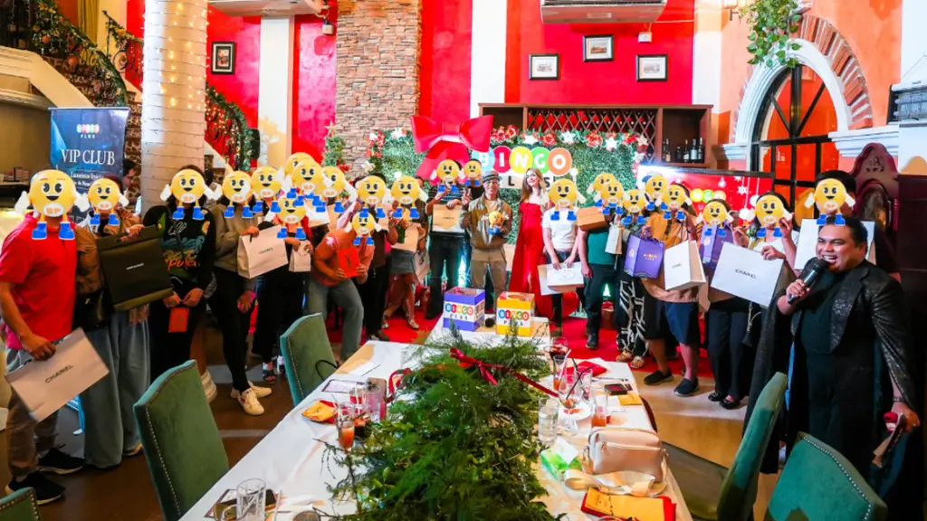 Guests take photos holding gifts