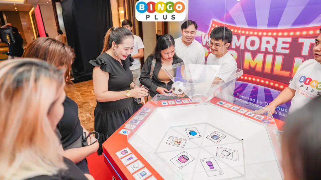 Guests enjoying drop ball at BingoPlus’ event booth