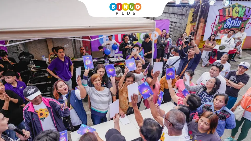 Residents participating in a game brought by BingoPlus at the Lucky Spin Community Fiesta.