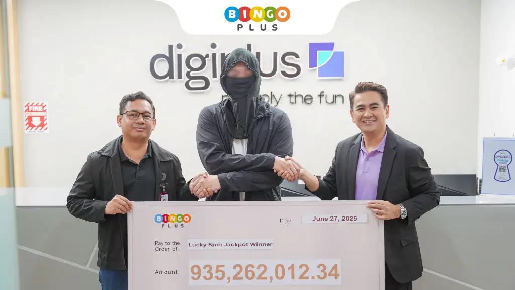 BingoPlus President presents the grand prize check to the Lucky spin jackpot winner