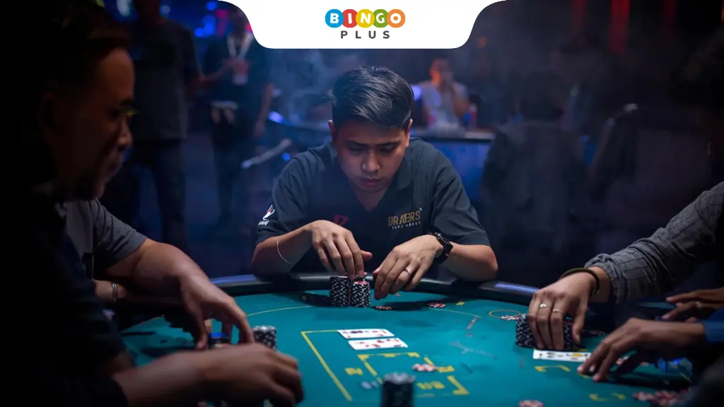 Players playing Texas Hold’em poker with chips and cards in the Philippines