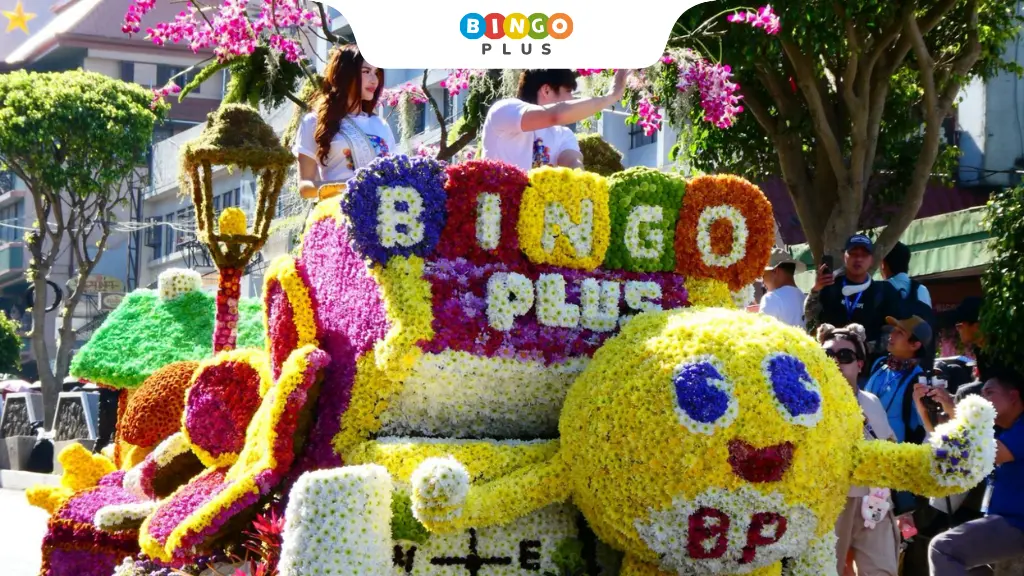 Miss Universe Yllana Aduana and Filipino actor and model Lance Carr ride on a BingoPlus float at the Panagbenga Grand Float Parade.